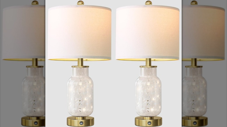 A set of Oneach glass table lamps in front of a gray wall
