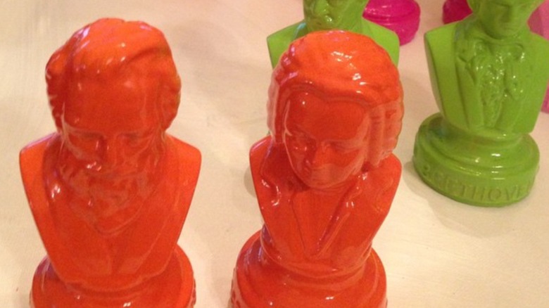 neon painted historical figure statues