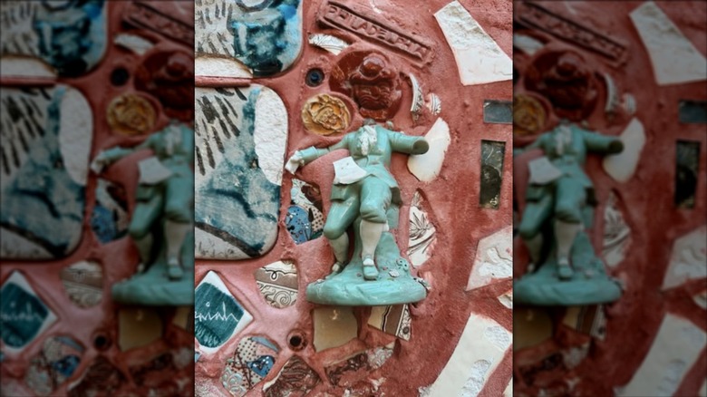 mosaic with embedded figurine