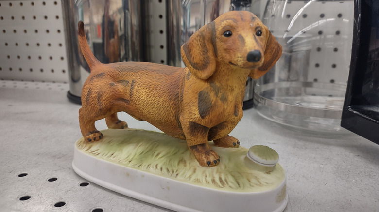 dog statue on thrift store shelf