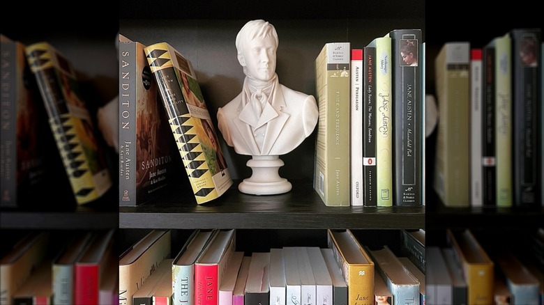 marble bust statue between books