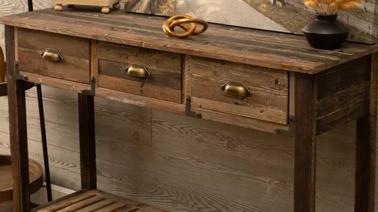 Wooden console table with three drawers