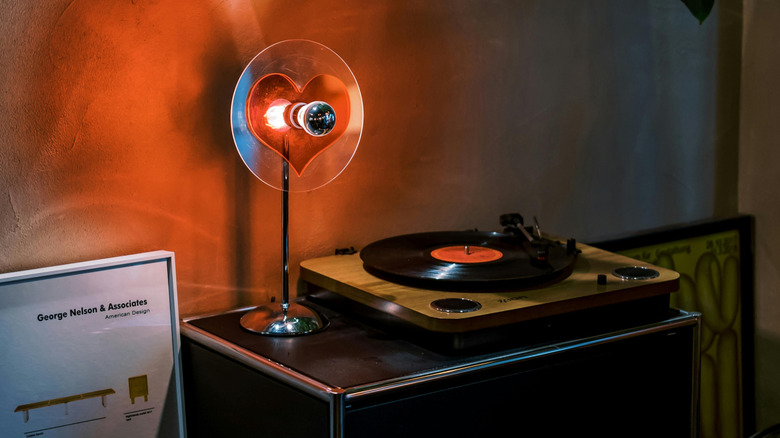 neon light beside retro vinyl record player