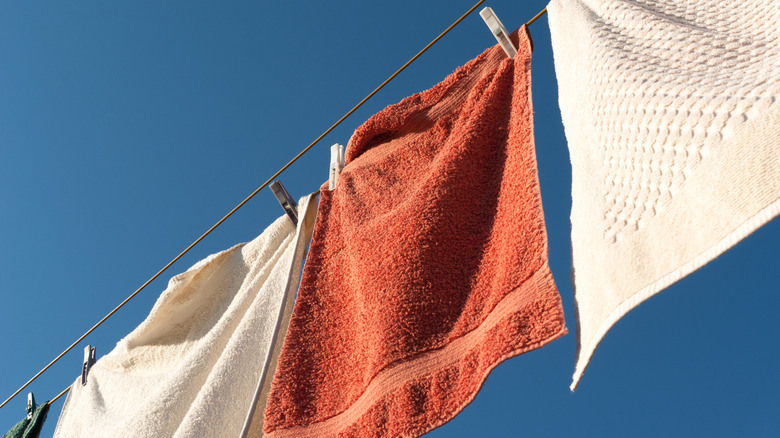 Towels hanging on a clothesline in the sun