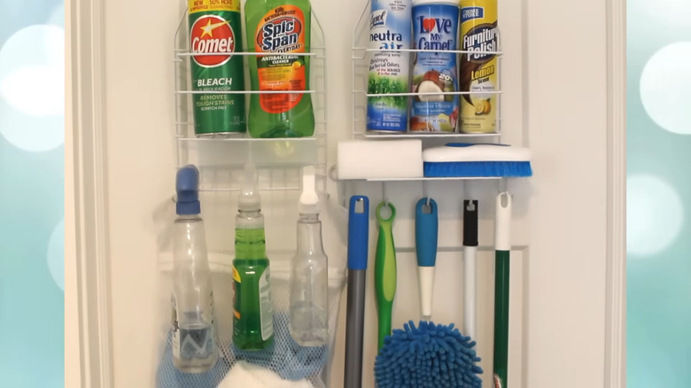 Cleaning supplies and tools on shower caddy on back of door