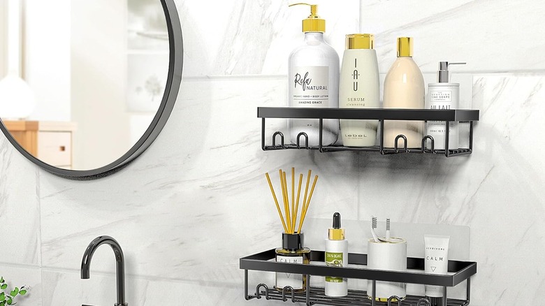 Shower caddy above bathroom sink and countertop with bathroom essentials