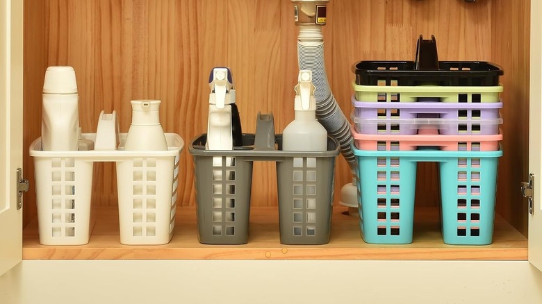 Basket-style shower caddies in wood under-sink area