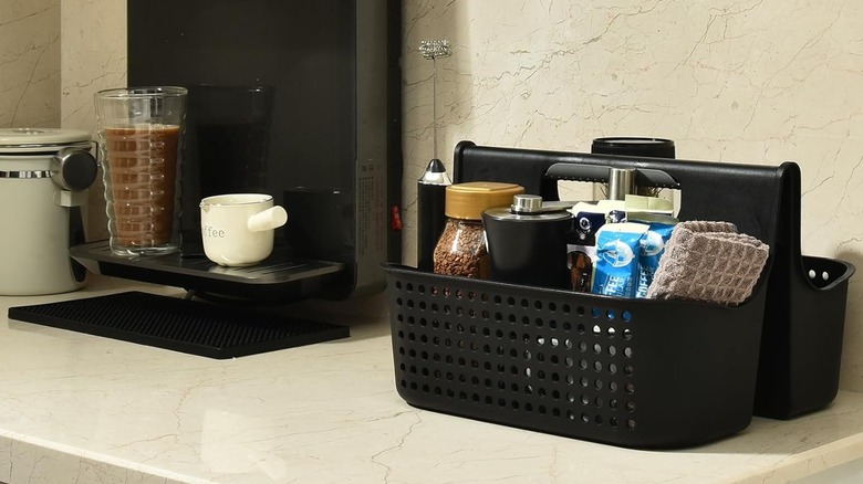 Black shower caddy and black coffee maker with kitchen countertop items