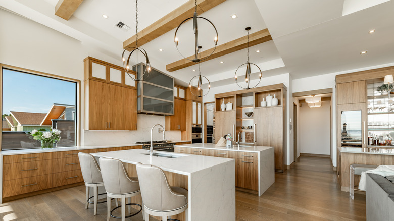 Light wood beams running across the ceiling in a kitchen