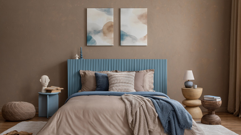 A brown bedroom wall with blue accents.