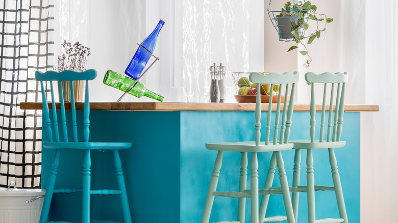 A kitchen island painted electric blue