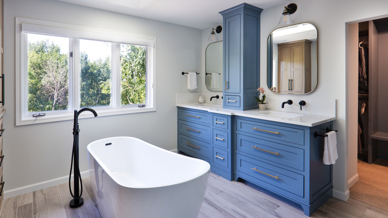 A bathroom with a blue vanity