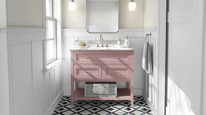 Single bathroom vanity with pink vinyl wrapping around the base