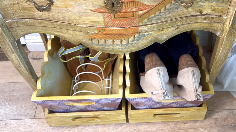 Wood bin with a plastic wire dish rack inside to keep shoes upright