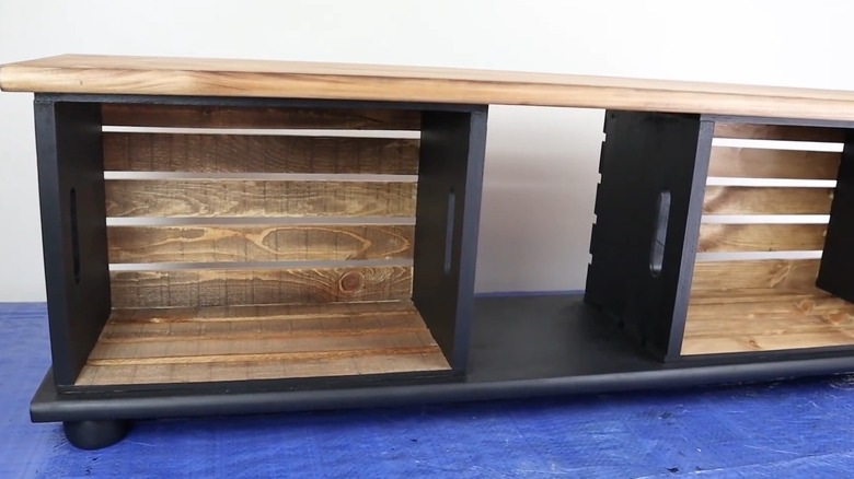 Storage shelf and bench made from two wood crates and two wood planks