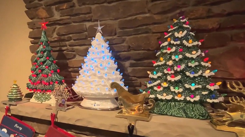 Three vintage ceramic Christmas trees on a mantel
