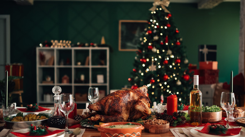 Christmas meal on a table with a Christmas tree in the background