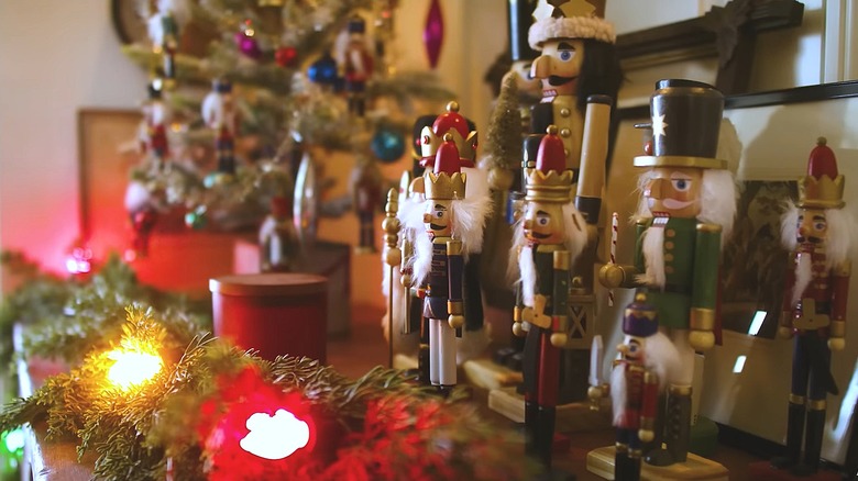 Collection of vintage soldier-style nutcrackers sitting on a mantel