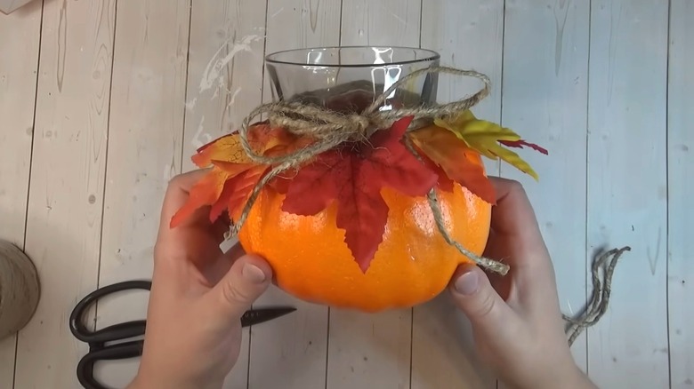 Plastic utensils in an orange foam pumpkin