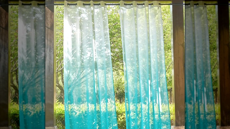 Blue ombre curtains hanging outside