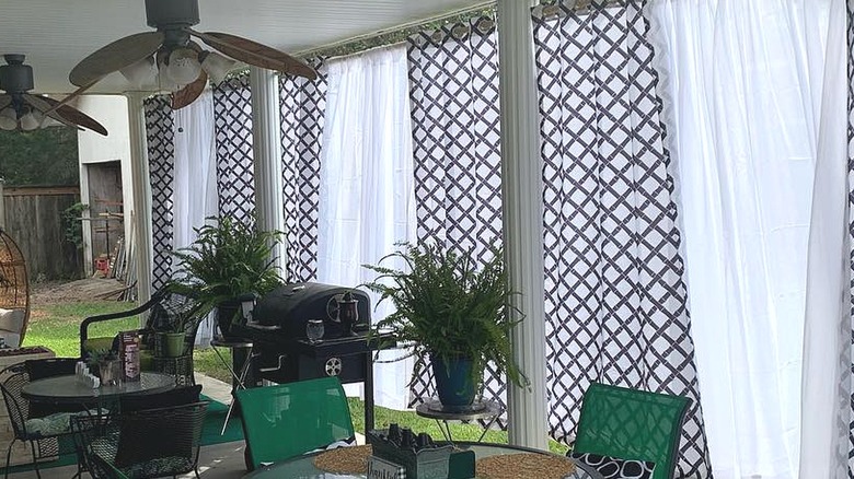 Geometric print and alternating white outdoor panels hanging on a patio