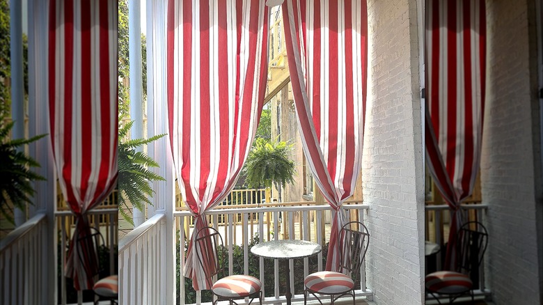 Red-striped curtains and matching striped chair cushions