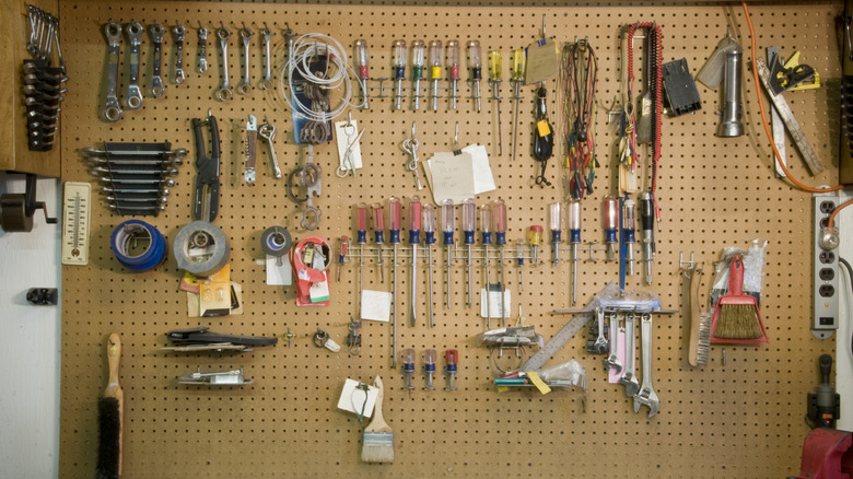 Various tools on wall-hanging rack