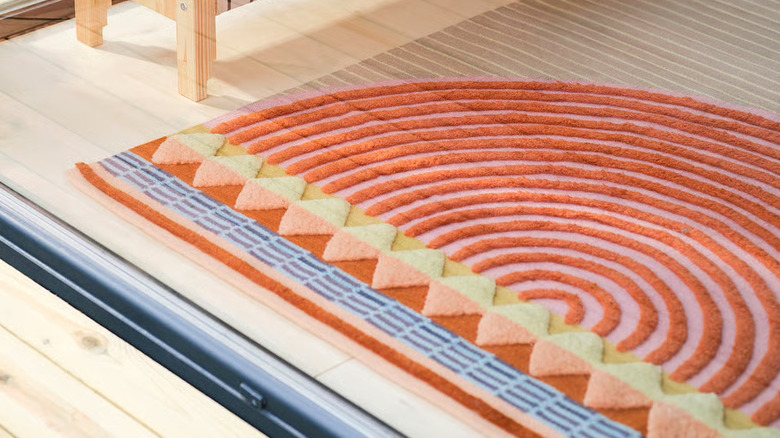 OMMJANGE rug on light colored wood floors