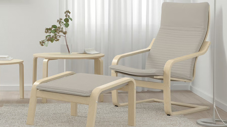 POANG armchair with footrest and table