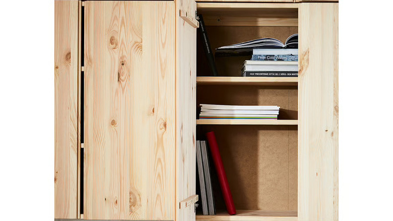 IVAR cabinet opened with books on the shelves