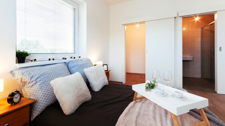 White sliding closet door in bedroom