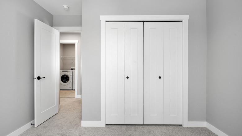 White closet doors in a gray room