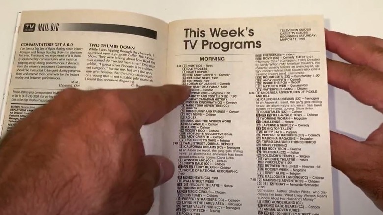 Man looking at vintage TV Guide