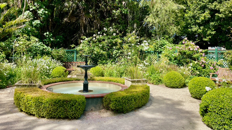 garden scene with fountain in middle