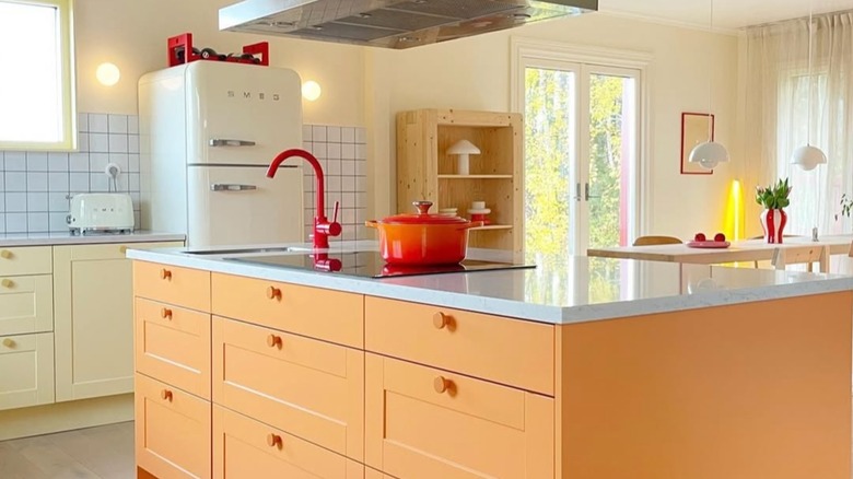 Retro kitchen with butter yellow and orange cabinets