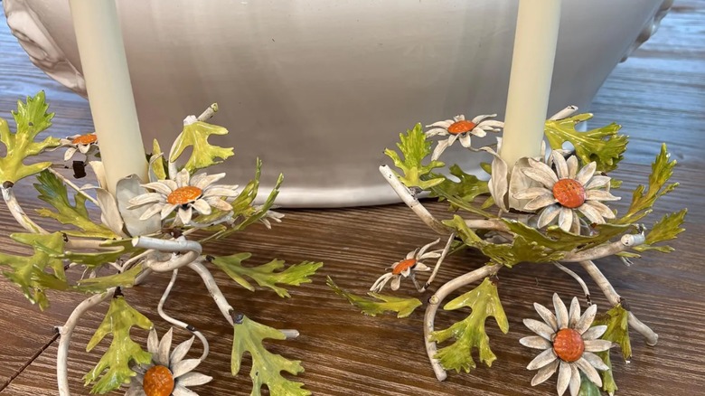 Two vintage flower and leaves candle stick.