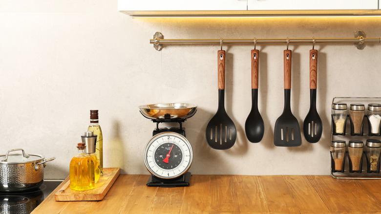 A kitchen counter with a retro set of manual scales