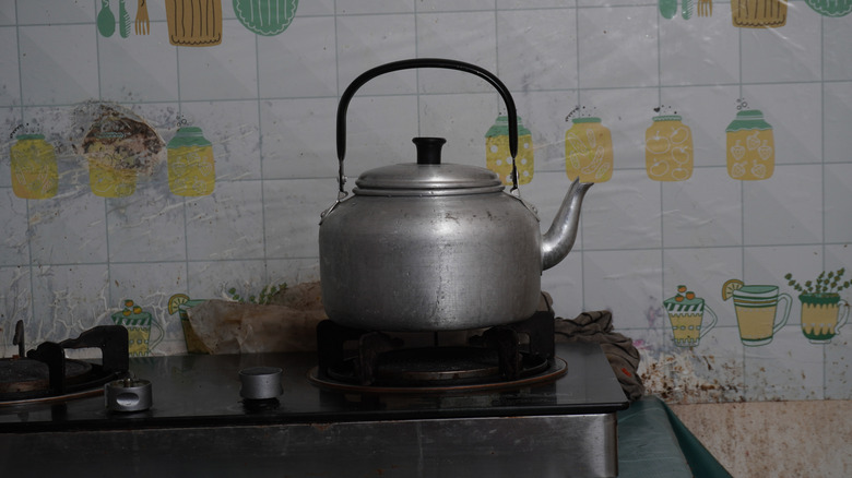 An old-school stovetop kettle on a stove