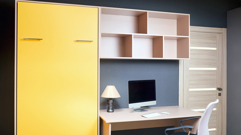 vibrant yellow retracted Murphy bed