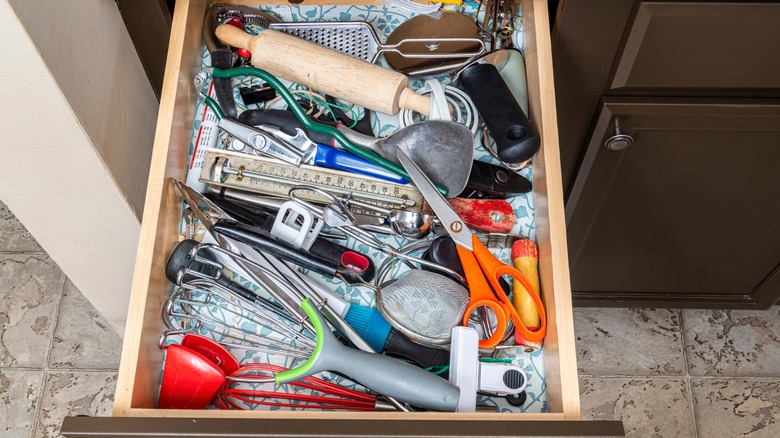 Kitchen junk drawer with utensils