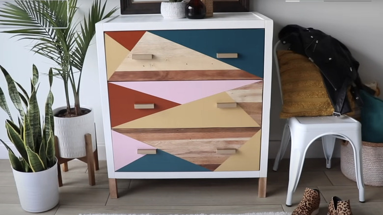 A modern dresser with color-block drawers.