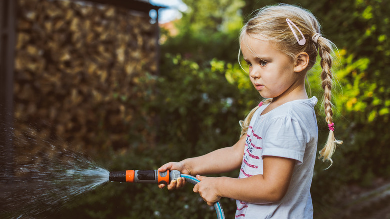 girl with garden hose