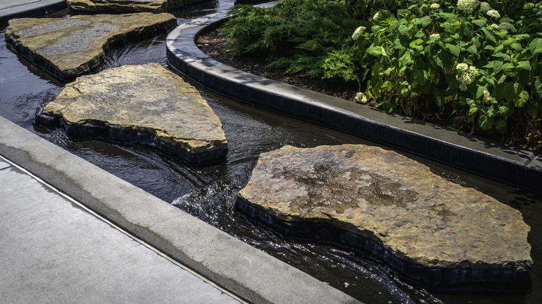 A fountain with large roughhewn stepping stones
