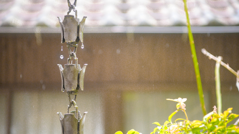 A closeup of an artisanal rain chain