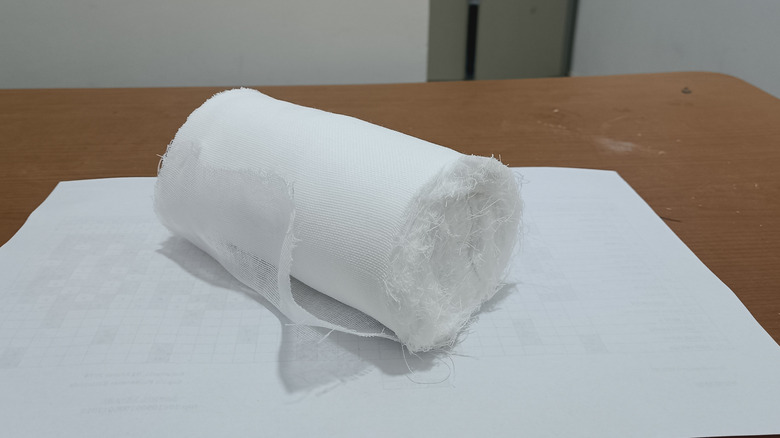 A white gauze roll lying on a table