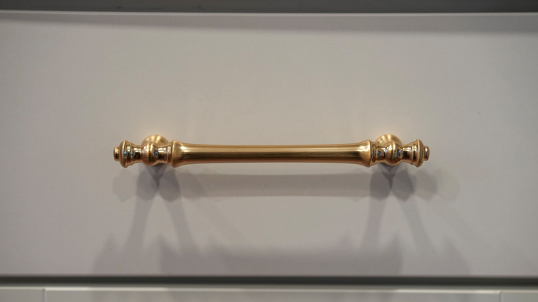 Close-up shot of a gold drawer pull