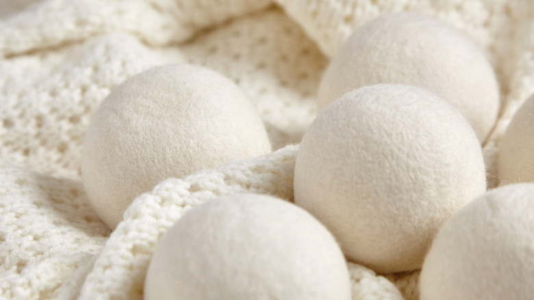 White dryer balls on a knit blanket