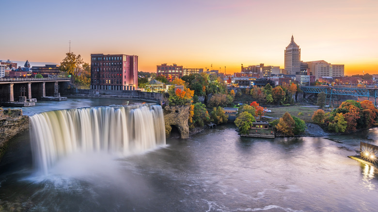 Rochester, New York, USA downtown skyline and waterfall from dusk till night.