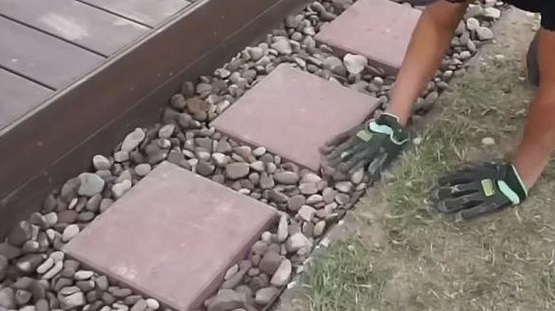 A river stone pathway with pavers.
