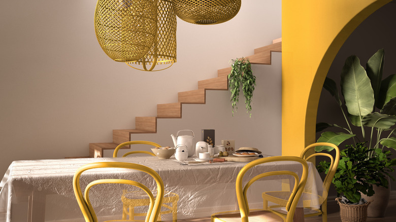 yellow dining chairs and wall